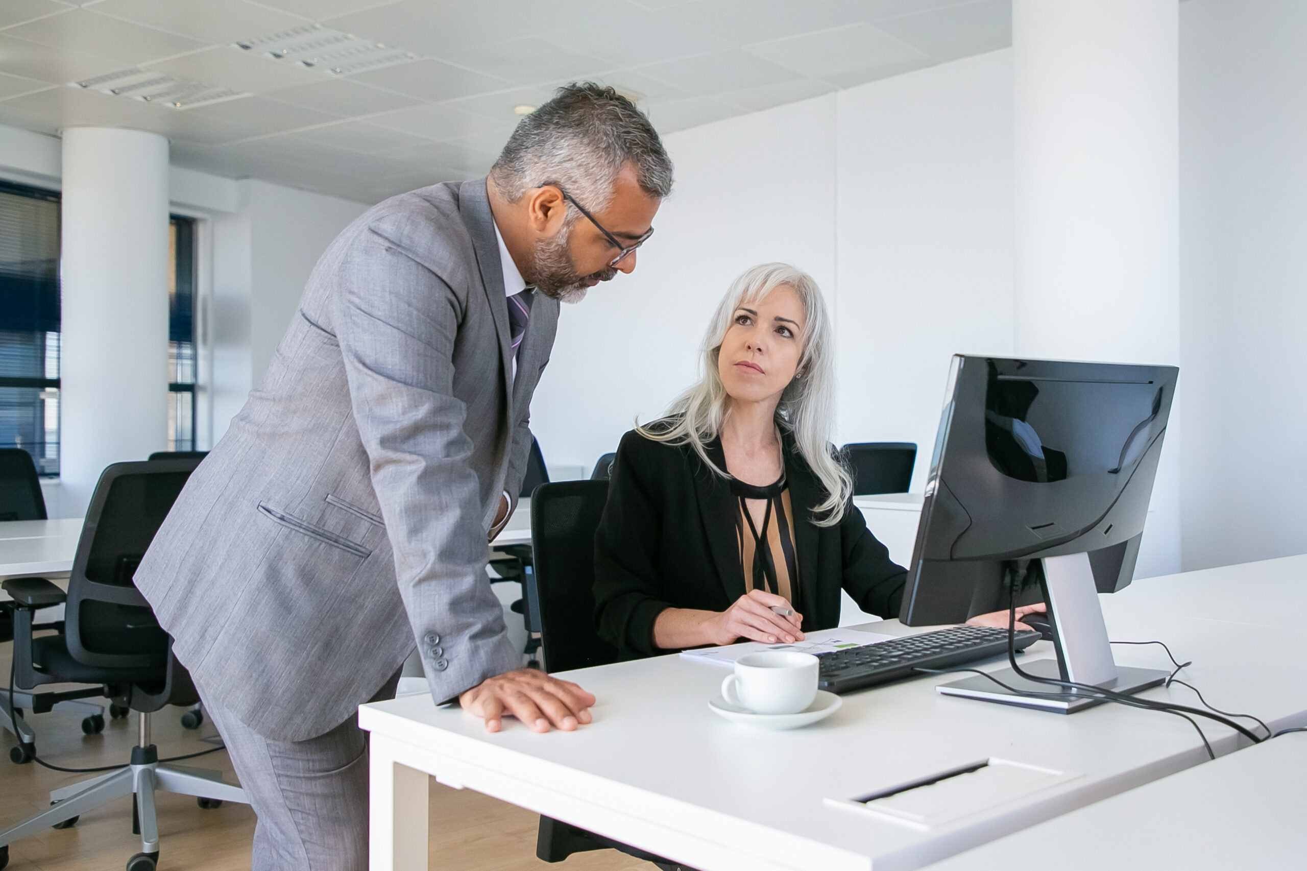 Serious male and female colleagues